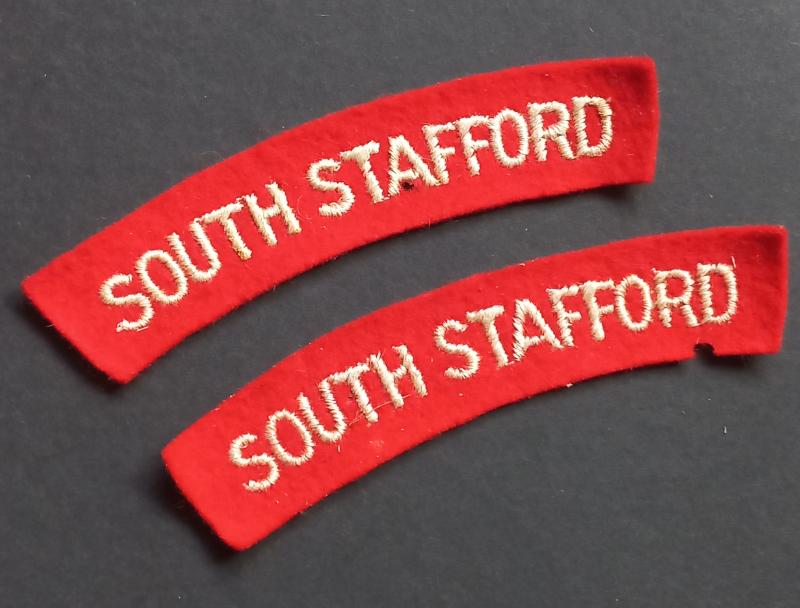 A attractive - full matching - set of white on red embroidered South Stafford shoulder titles