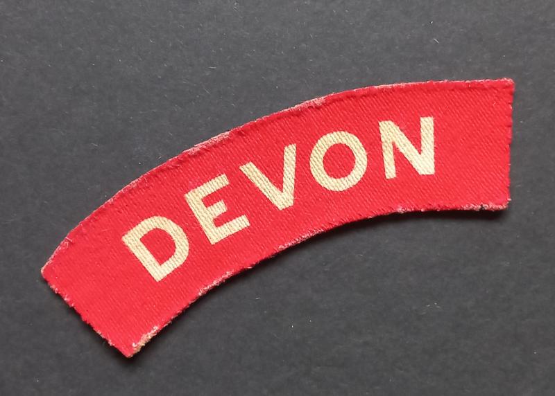 A superb printed Devonshire Regiment shoulder title