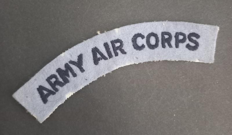 A neat - unfortnatly post war issue - Army Air Corps embroided shoulder title