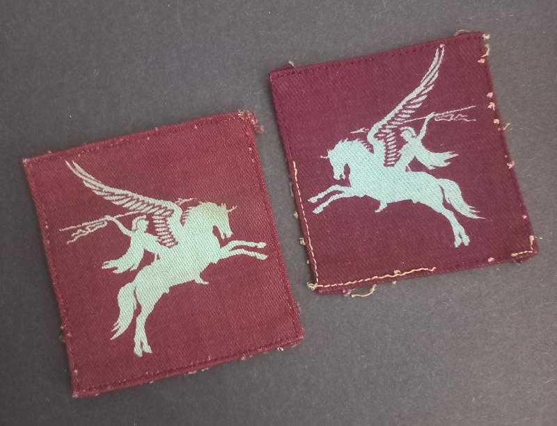 A attractive pair of issued - removed from uniform - (unfortunately non matching) printed Airborne 'Pegasus' Division shoulder formation signs