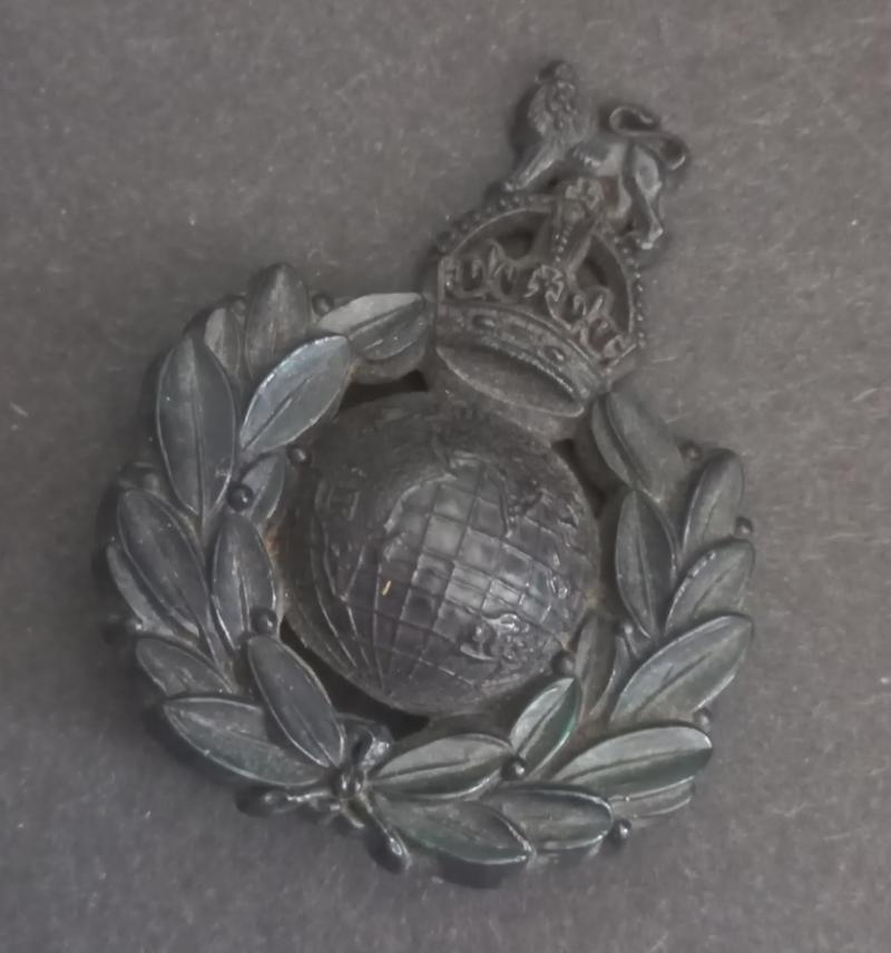 A superb and difficult to find bakelite i.e plastic Royal Marines cap badge