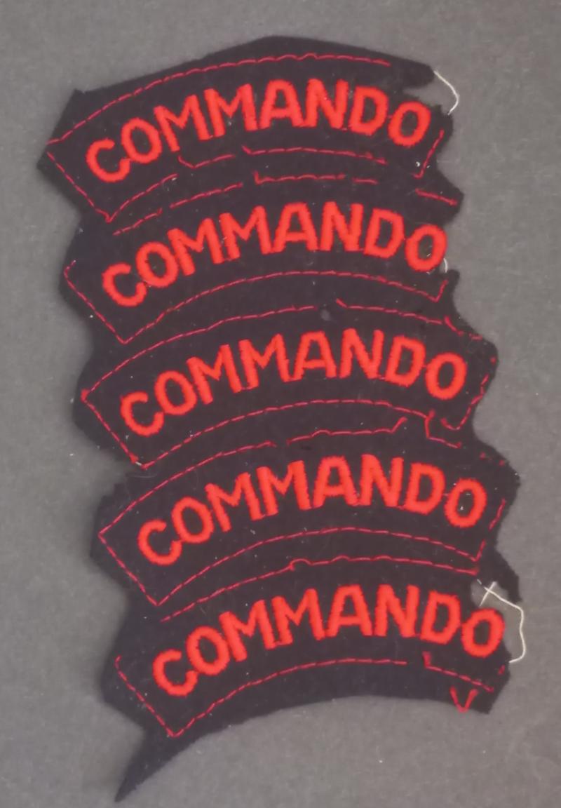 A very attractive - and not seen before - unfinished strip of five (red on black) Commando shoulder titles