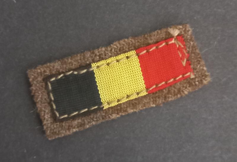 A very attractive little Belgian national flag as intended to wear by Belgian volunteers on there battle-dress blouse