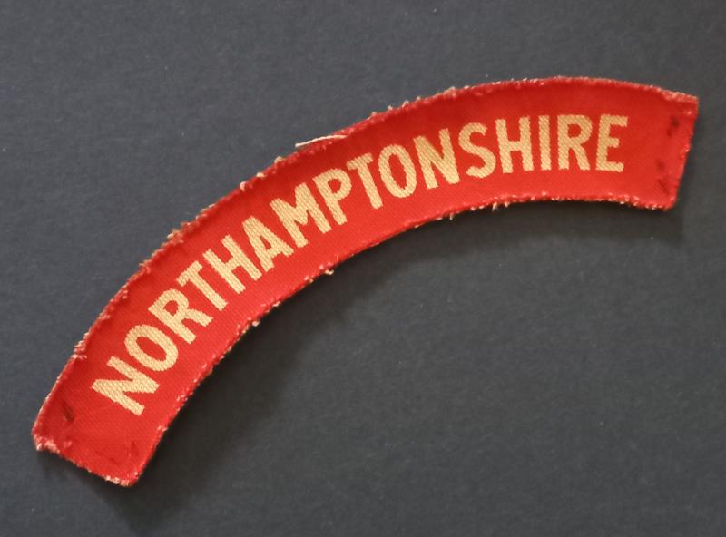 A superb - albeit regrettably single - Northhamtonshire Regiment printed shoulder title