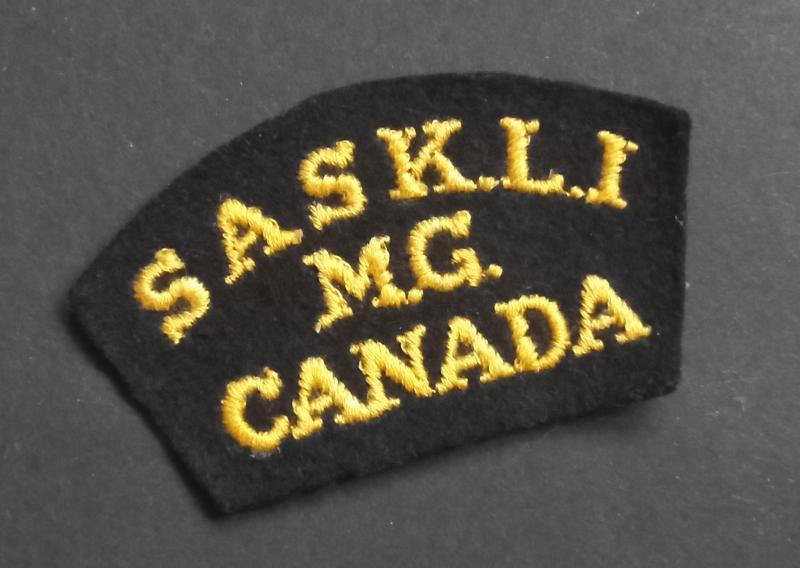 A great (typical British made) SASKLI - Saskatoon Light Infantry - MG embroided glue i.e past back shoulder title
