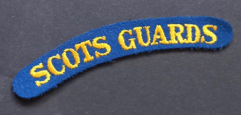 A great and nice - un-issued - embroided Scots Guards shoulder title