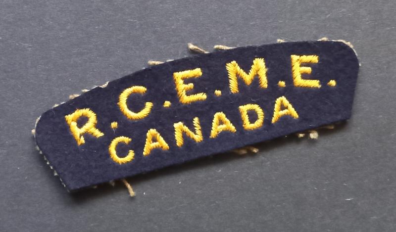 A superb (British made) R.C.E.M.E. - Royal Canadian Electrical & Mechanical Engineers- embroided shoulder title