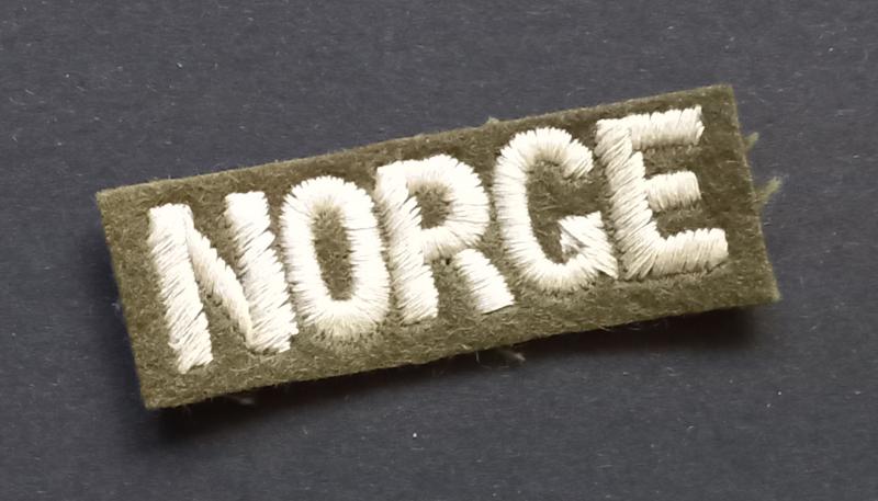 A nice - British made - Norwegian/NORGE shoulder title as intended to wear by Norwegian volunteers on there battle-dress blouse