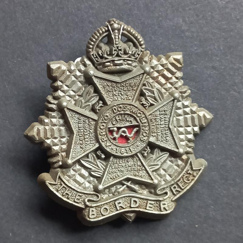 A attractive (now days not so easy to find) plastic i.e bakelite The Border Regiment cap badge