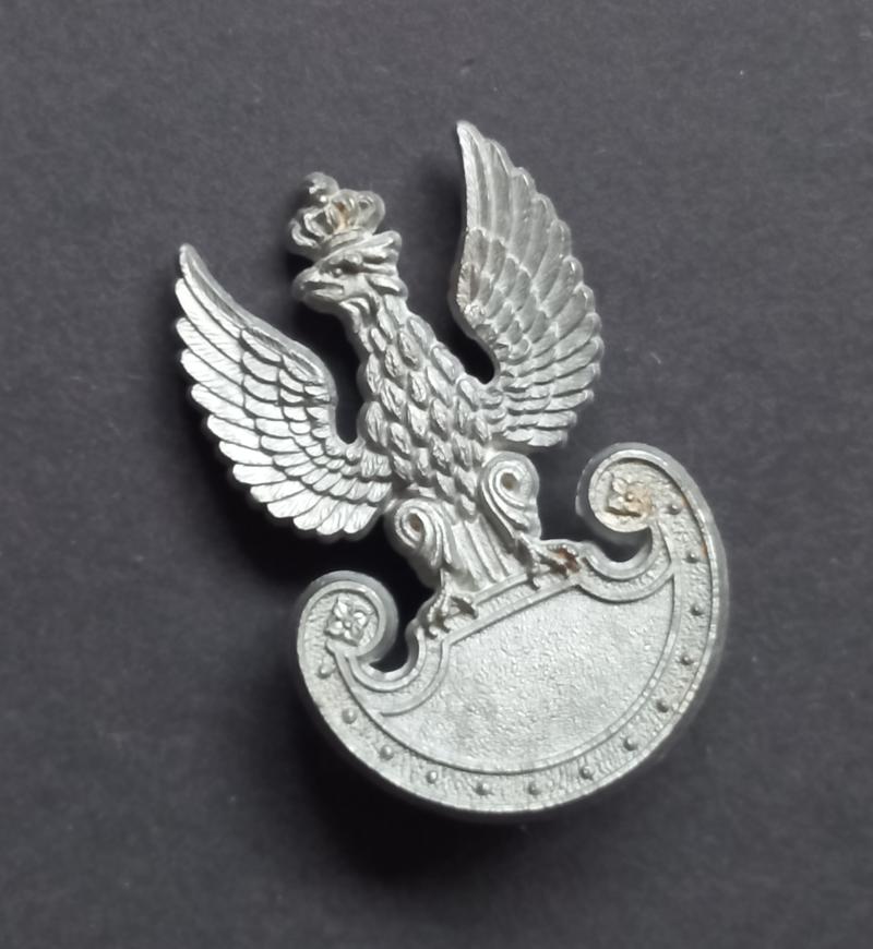 A attractive and sought after Polish plastic i.e bakelite cap badge