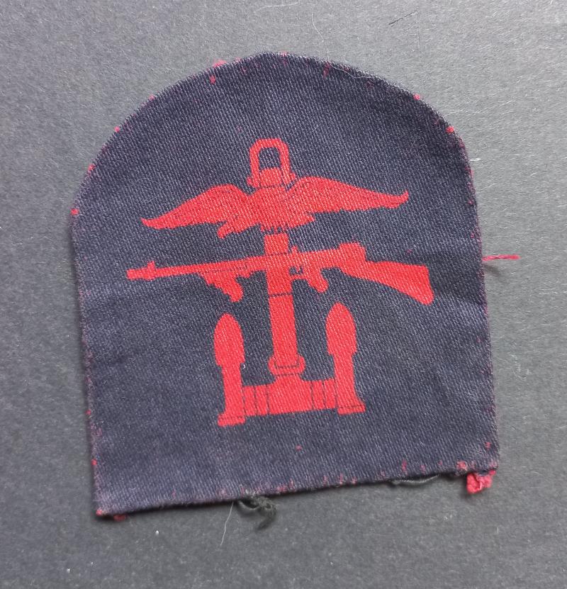 A perfect - left facing - regrettably single printed Combines Operation formation badge
