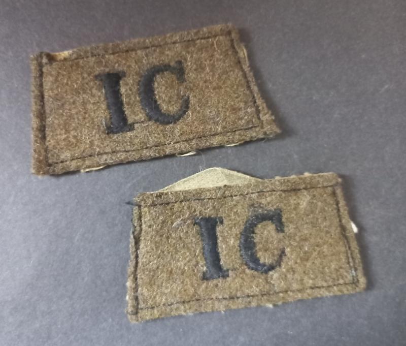 A superb and un-issued set of - fully matching - I.C. (Intelligence Corps) black on khaki early shoulder slip-ons