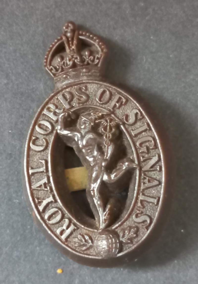A attractive Royal Corps of Signals brown plastic cap badge