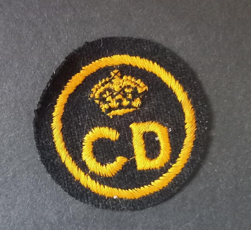 A nice British CD (Civil Defence) un-issued beret badge