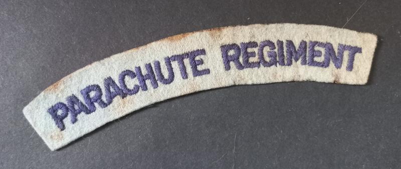 A nice - regrettably single - un-issuesd so called paste back i.e glue back embroided Parachute Regiment shoulder title