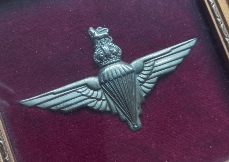 A nicely framed - nickel plated - Parachute Regiment beret badge (unfortunately missing its two brass lugs)