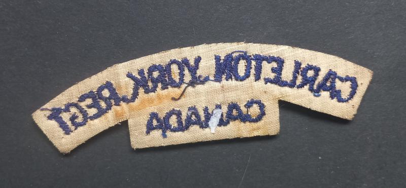 A superb un-issued British made Canadian Carleton York Regiment embroided (with white backing) shoulder title