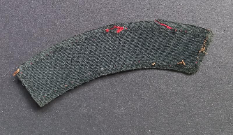 A attractive (unfortnately damage) printed C.M.P. (Corps of Military Police) shoulder title