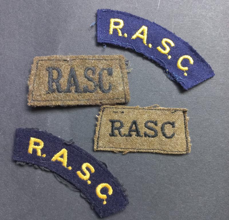 A small selection of R.A.S.C. (Royal Army Service Corps) shoulder titles and early slip-ons