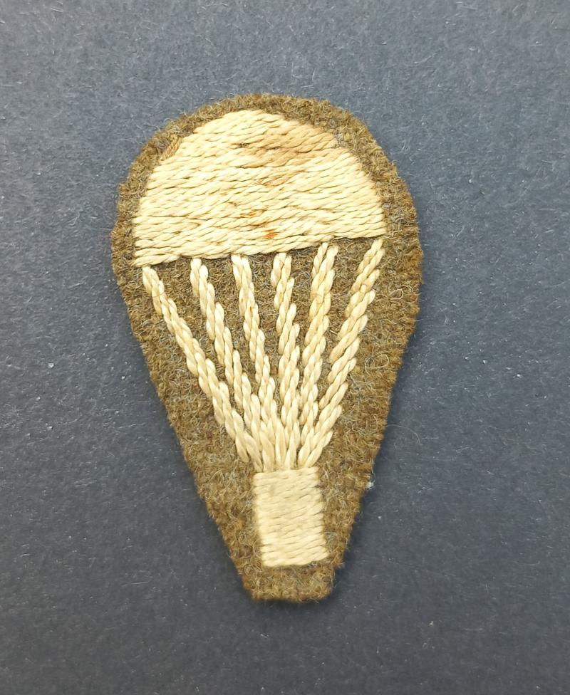 A nice and issued (removed from uniform) early type 'Light Bulp' qualification badge