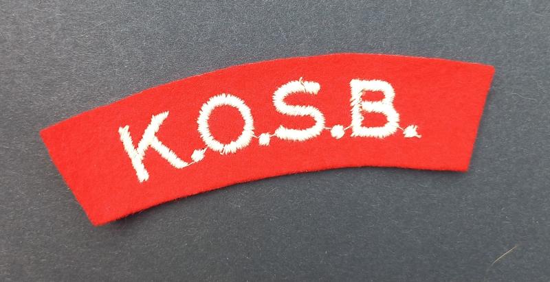 A nice and un-issued embroided K.O.S.B. (Kings Own Scottish Borderers) shoulder title