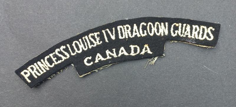 A superb and un-issued (British made white backing) Canadian Princess Louise IV Dragoon Guards embroided shoulder title