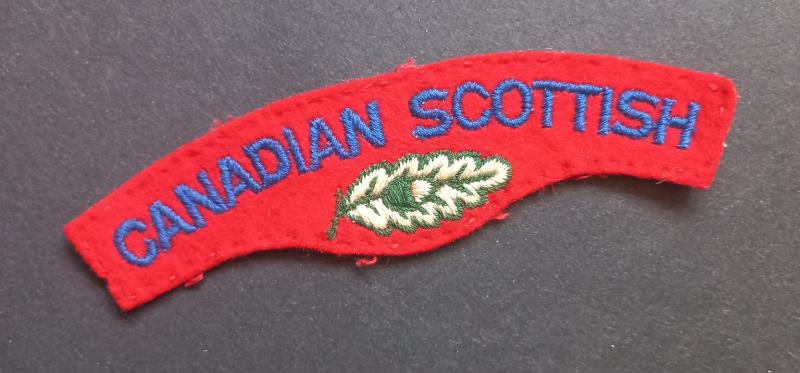 A attractive - typical British made - issued Canadian Scottish embroided shoulder title