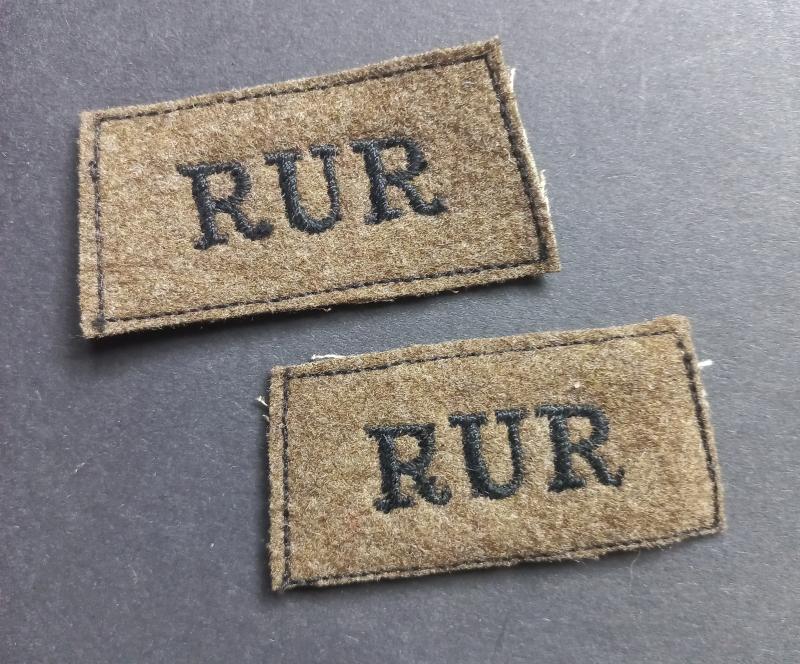 A early (fully matching) set of RUR - Royal Ulster Rifles - black on khaki shoulder slip-ons