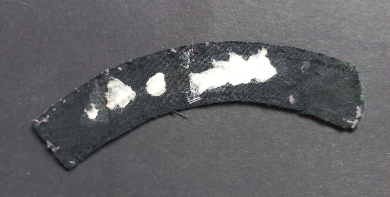 A nice example of a (difficult to find and issued) printed Royal Ulster Rifles shoulder title