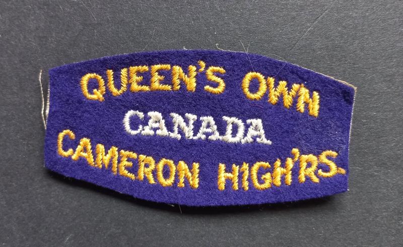 A neat (un-issued white backing) British made Canadian Queens Own Cameron Highlanders shoulder title