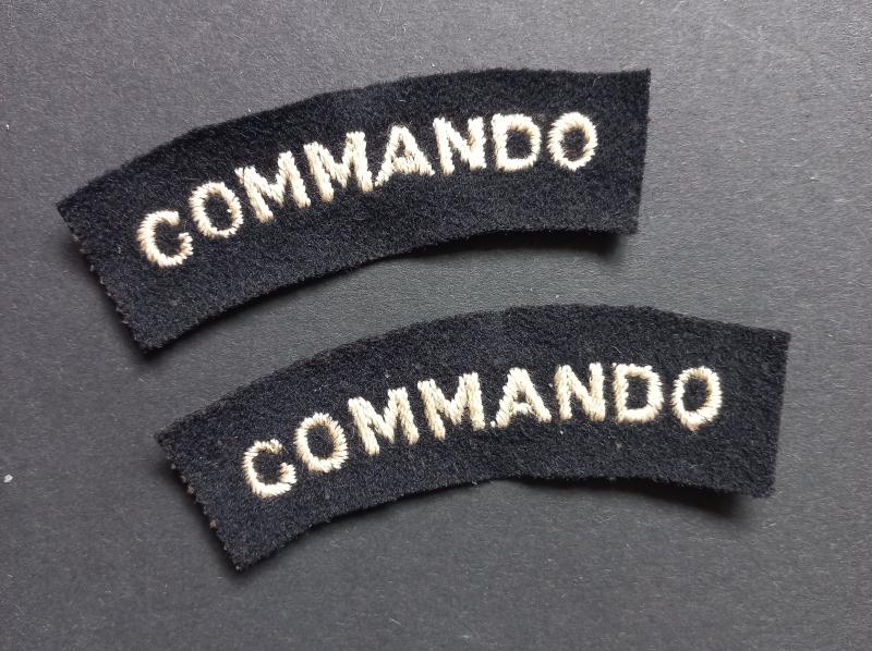 A superb - full matching set - mid war period white on black embroided commando shoulder titles